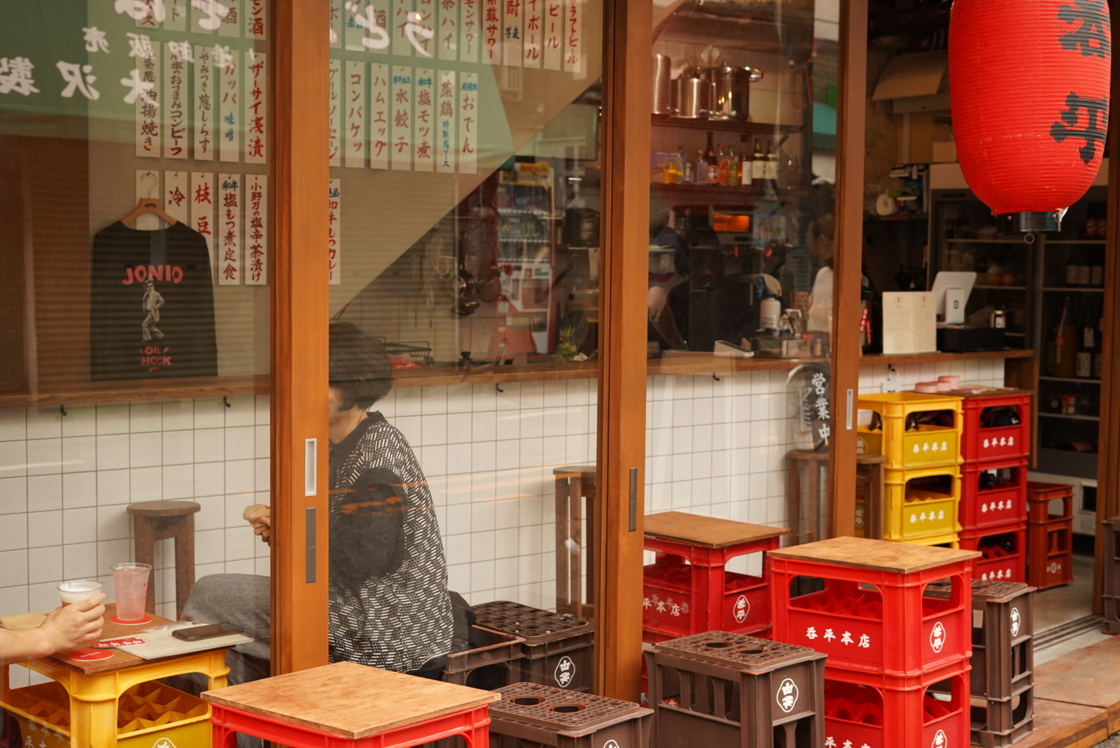 LIFE IN TOKYO, comeone seating in a bar